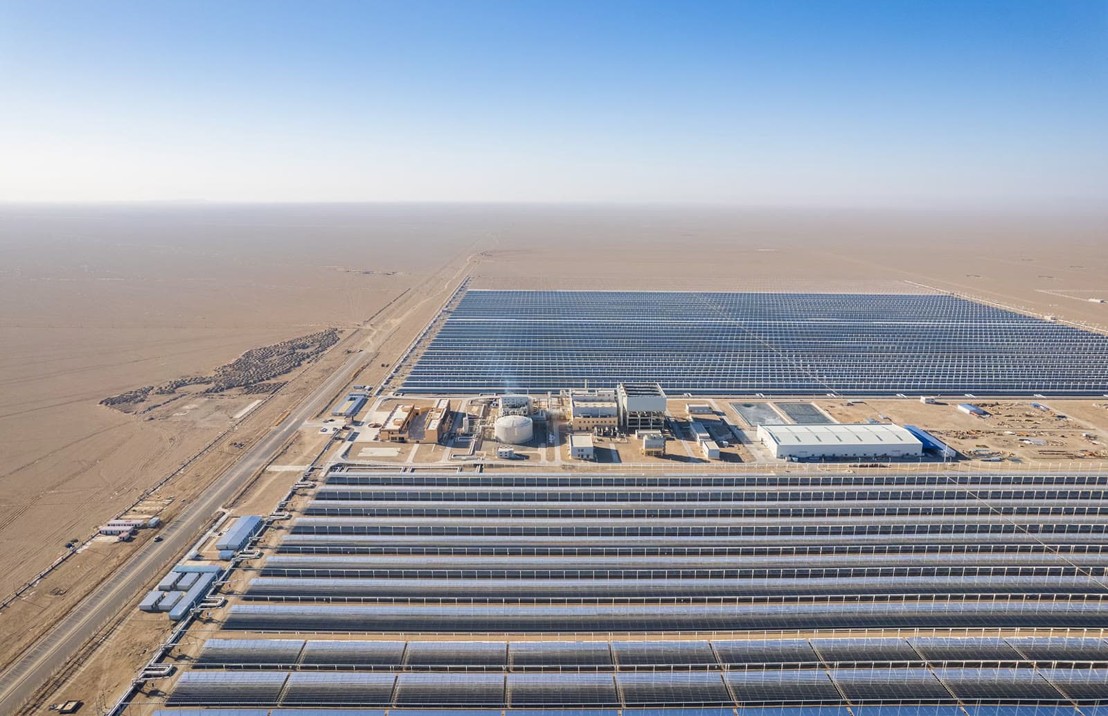 Aerial view of a large solar farm in open desert